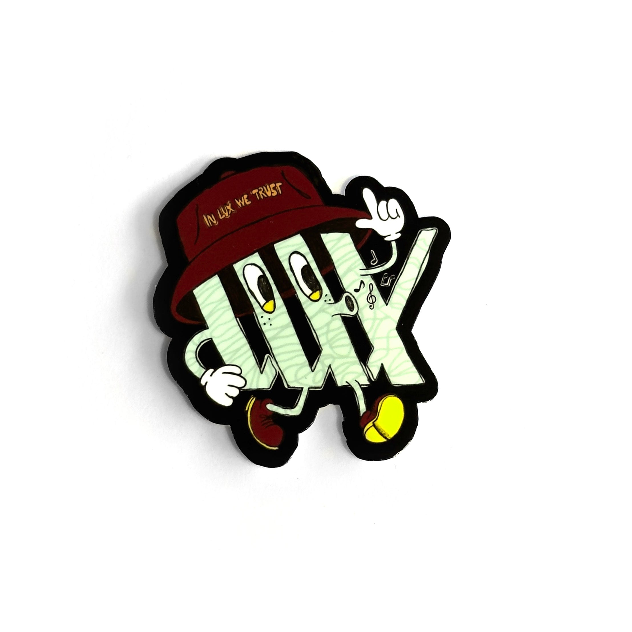 A cartoon character designed as a money stack with eyes and a mouth wears a red hat with the slogan "IN LUX WE TRUST" while flashing a peace sign. This whimsical design is showcased on the new LUXBMX Whistling Logo Sticker, made from waterproof vinyl to give your gear an extra touch of style.