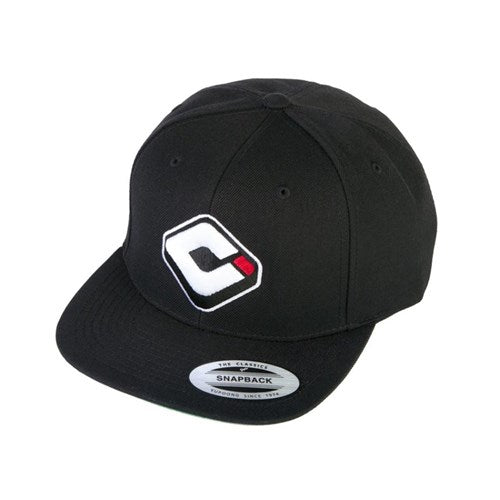 The ODI Icon Logo Hat is a sleek black snapback with a flat brim, featuring a stylized white "C" and small red square logo. Ideal for BMX fans, it has an adjustable snapback closure for the perfect fit.