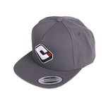 The ODI Icon Logo Hat is a gray BMX snapback with a flat brim, featuring a stylized "C" logo on the front and an adjustable snapback closure.