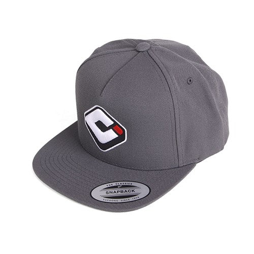 The ODI Icon Logo Hat is a gray BMX snapback with a flat brim, featuring a stylized "C" logo on the front and an adjustable snapback closure.