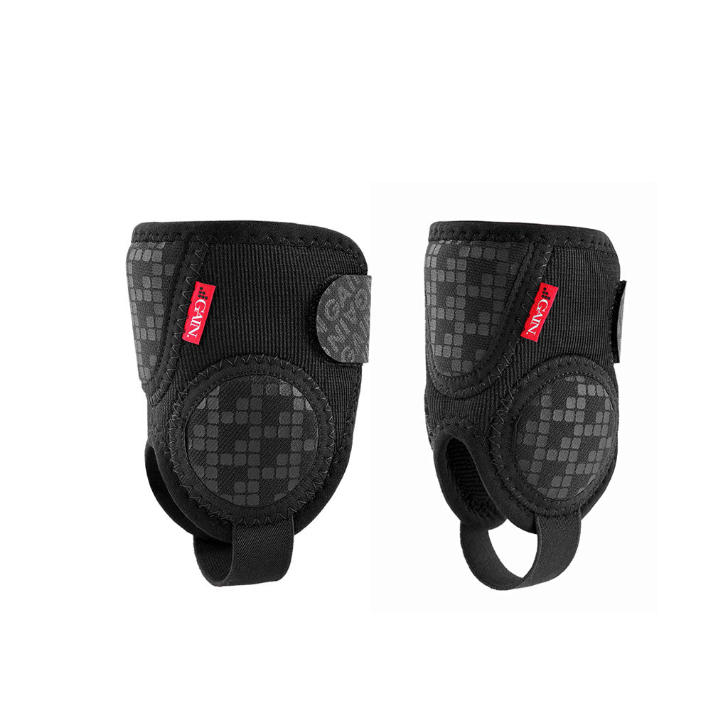 Two GAIN Protection Pro ankle protectors in black, featuring checkered patterns and red tags, designed for enhanced impact protection and support.