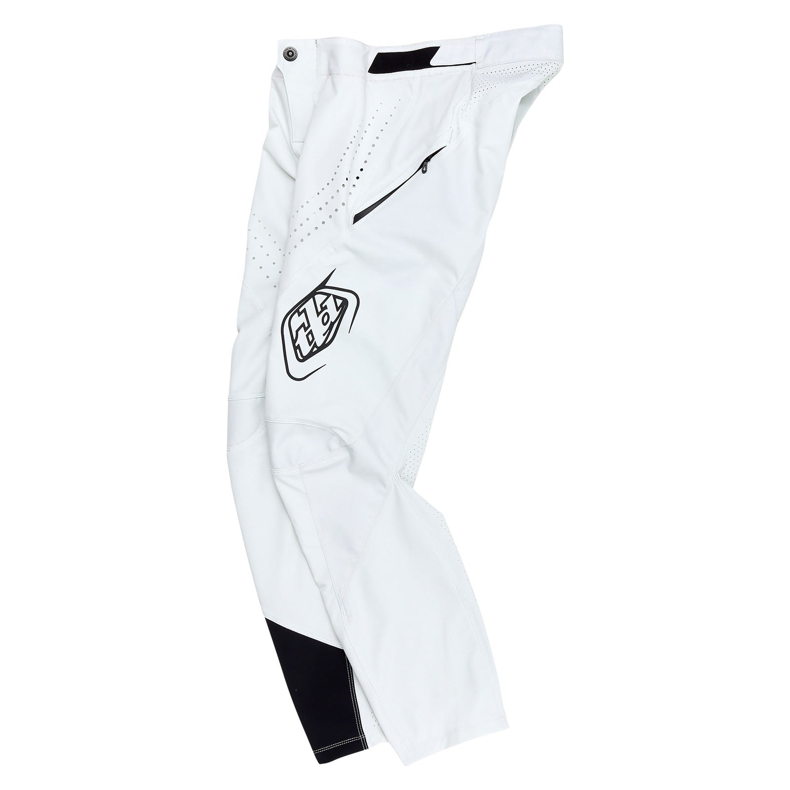 Introducing the TLD 25.1 Sprint Pant / Mono Chalk: white athletic pants with black accents, a logo on the thigh, zipper pocket, reinforced knees, and perforated sections for ventilation. Race-ready design ensures peak performance and style.