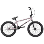 The Kink Launch 20 Inch Bike is a pink BMX bicycle equipped with components from Kink BMX, featuring thick black tires, a sleek black seat, and matching handlebars.