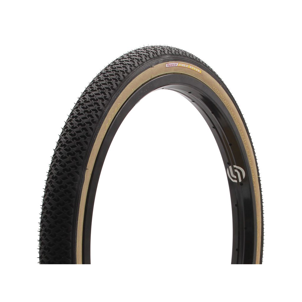 A Panaracer Freestyle HP Tyre with original tread, a black tread, a tan sidewall, branding on the side, and can be inflated up to 85 PSI.