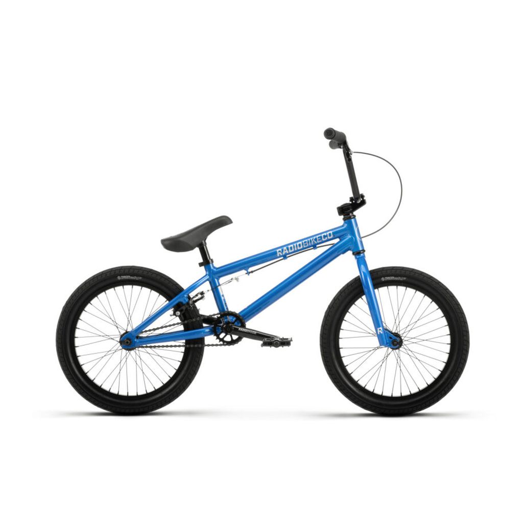 Side view of the Radio Dice 18 Inch bike in blue, featuring a black seat, black handlebars, and Salt Tracer Tyres.