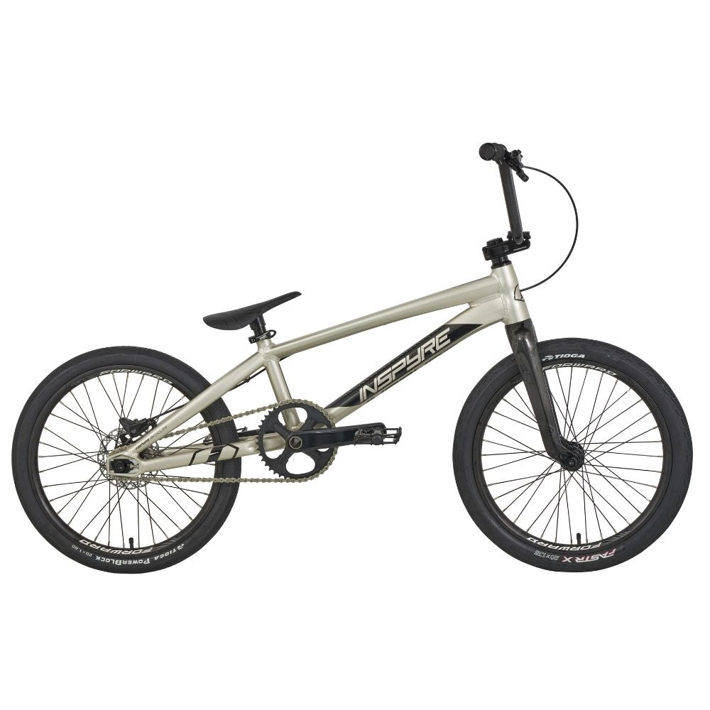 The Inspyre Evo-C Disc Pro L Bike 2025 in silver features a compact frame for BMX racing, black handlebars and wheels, and the "Inspyre EVO" branding against a white background. It includes Shimano hydraulic disc brakes for precision and performance.