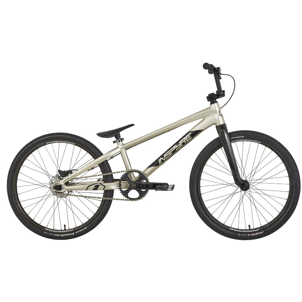 The Inspyre Evo-C Disc Pro Cruiser Bike 2025 sports a sleek black seat and handlebars with "Inspyre EVO" on its silver frame, equipped with Shimano hydraulic disc brakes for top-notch performance.