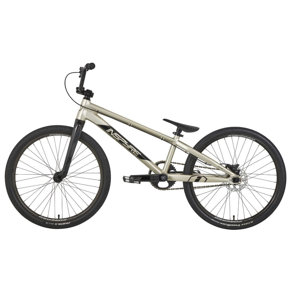 A silver Inspyre Evo-C Disc Pro Cruiser Bike 2025 with black handlebars, seat, and tires is set against a white background, featuring Shimano hydraulic disc brakes for precise stopping power.