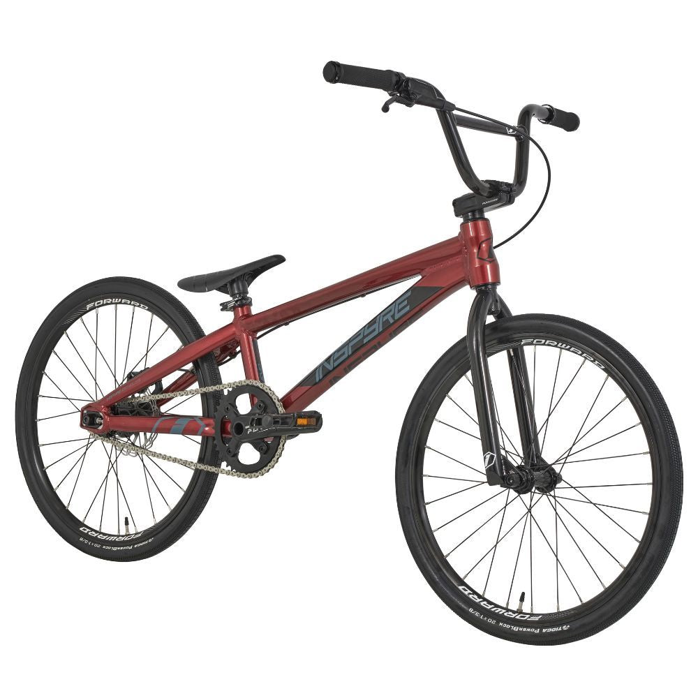 The Inspyre Evo Disc Expert Bike 2025 in red boasts a sleek frame with black handlebars and wheels, embodying the speed and agility typical of race bikes.