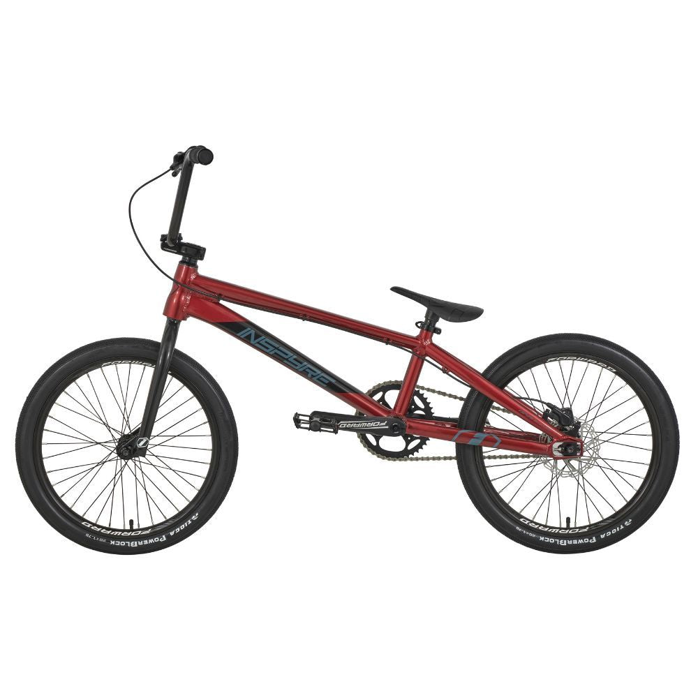 The Inspyre Evo Disc Pro L Bike 2025 in red, with black tires and handlebars, features a lightweight frame and race geometry for agility and speed, enhanced by its single-speed gear system.