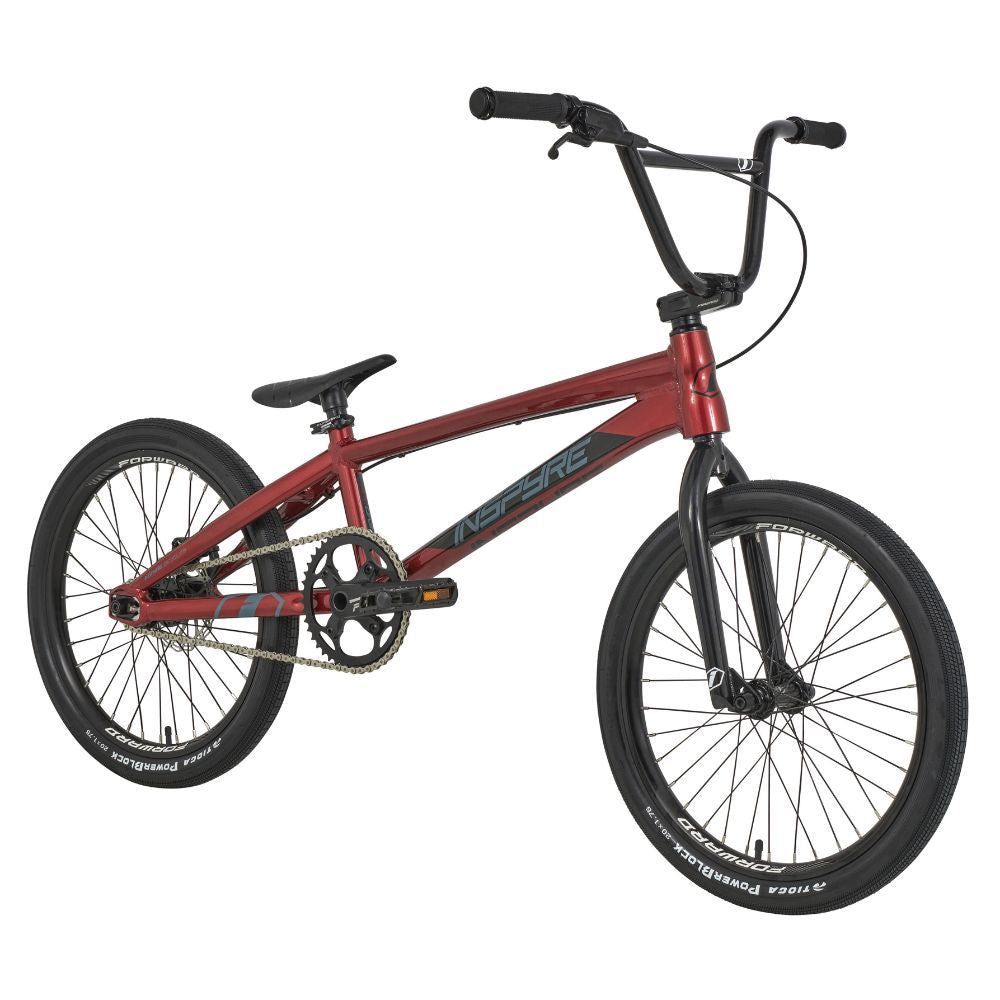 The 2025 Inspyre Evo Disc Pro XXL Bike features a red BMX frame, black handlebars, and thick tires ideal for racing, complete with precise hydraulic disc brakes.