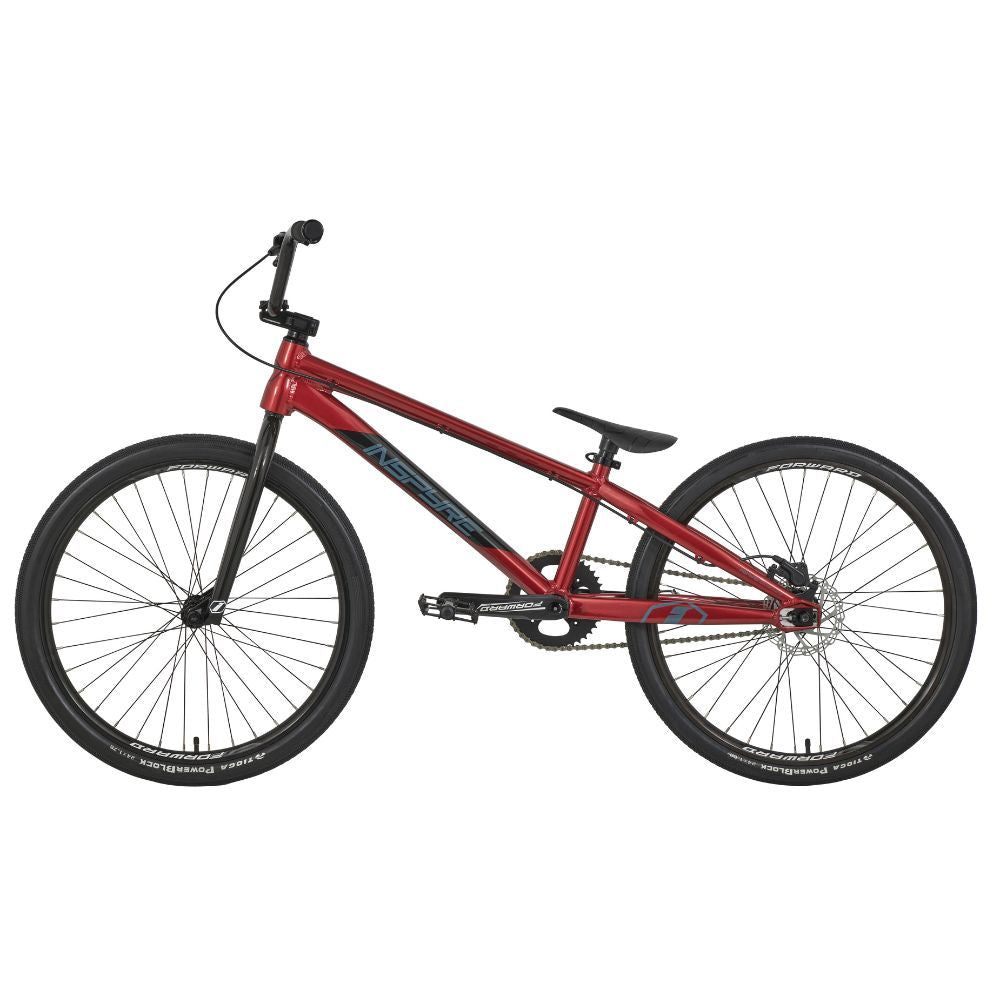 The Inspyre Evo Disc Pro Cruiser Bike 2025 features a bold red frame complemented by black wheels, race geometry, and a horizontal top tube.