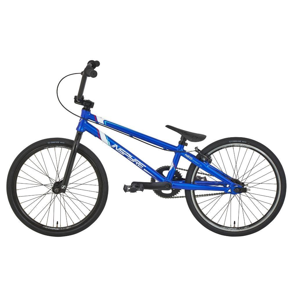 The Inspyre Neo Expert XL Bike, an entry-level blue BMX race bike with a "Next" logo, featuring black wheels, handlebars, and pedals, is presented on a white background.