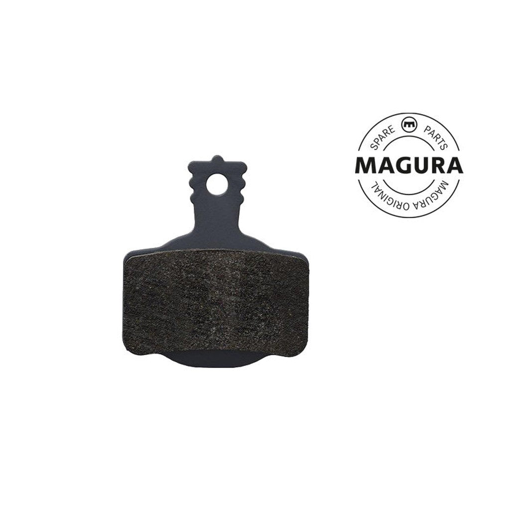 Magura 7 Series MT Disc Brake Pad with a black backing and dark friction material, featuring a high-performance compound, displayed next to a circular "Magura Original Spare Parts" logo.