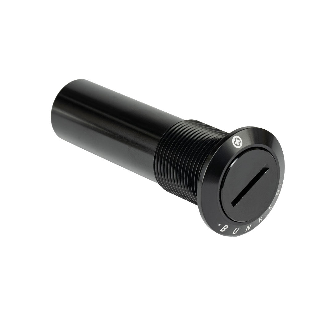 A black cylindrical object with a slot on one end, the Salt Plus Bunker M24 Fork Preload Bolt is ideal as a discreet stash spot.