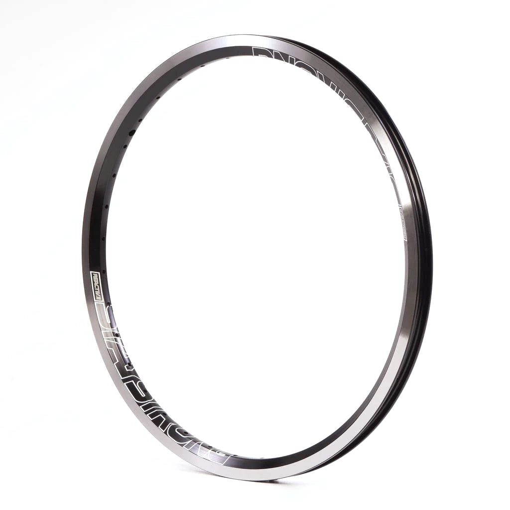 Close-up of a sleek black and silver Staystrong Reactiv-2 Rim 20 x 1.75 /36 Hole, crafted for professional race performance, set against a pristine white background.