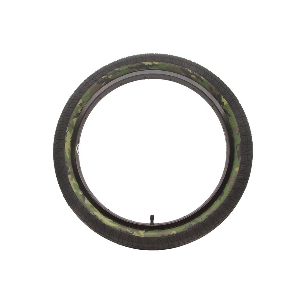 The DRS Vise Camo Tyre showcases a green camouflage design on a white backdrop, providing excellent traction at an affordable cost.