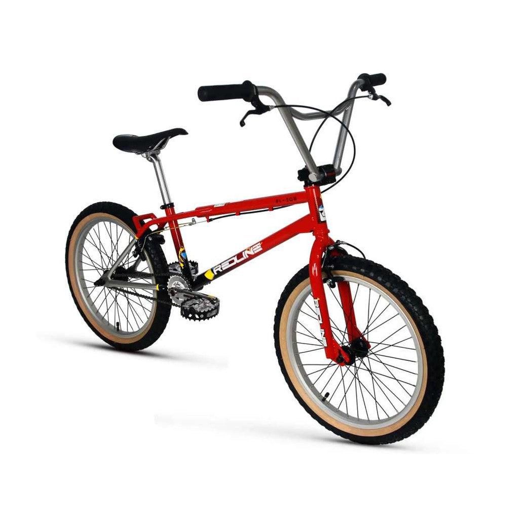 The Redline RL20B Retro 20 Inch Bike, showcasing a striking red 4130 Chromoly frame paired with a black seat and silver handlebars, features beige tires set against a crisp white backdrop.