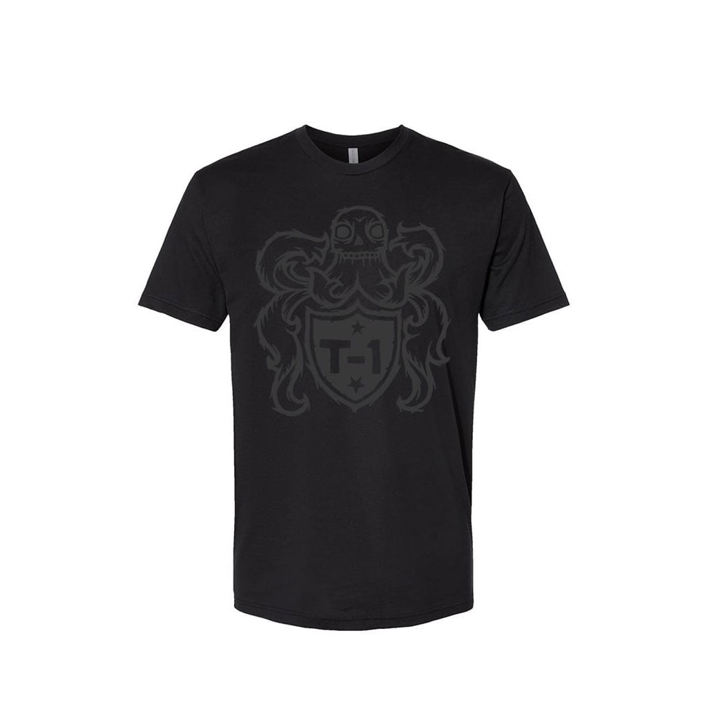 The Terrible One Crest T-Shirt is a black tee showcasing a gray octopus design above an inscribed "T-1" shield on a white backdrop. Embrace casual fashion proudly with this exceptional brand piece.