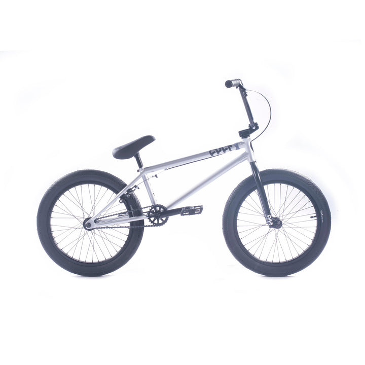 The Cult Gateway 20 Inch Bike features a premium design with a sleek silver frame, black seat, handlebars, and thick tires. Set against a white background, it showcases robust craftsmanship in every detail.