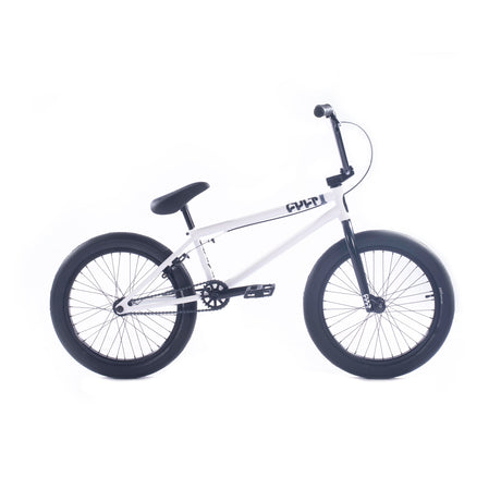 The Cult Gateway 20 Inch BMX bike, with a white frame and black handlebars, seat, and wheels, features a minimalist design adorned with "CULT." This BMX model emphasizes premium craftsmanship, ideal for those who value both style and performance.