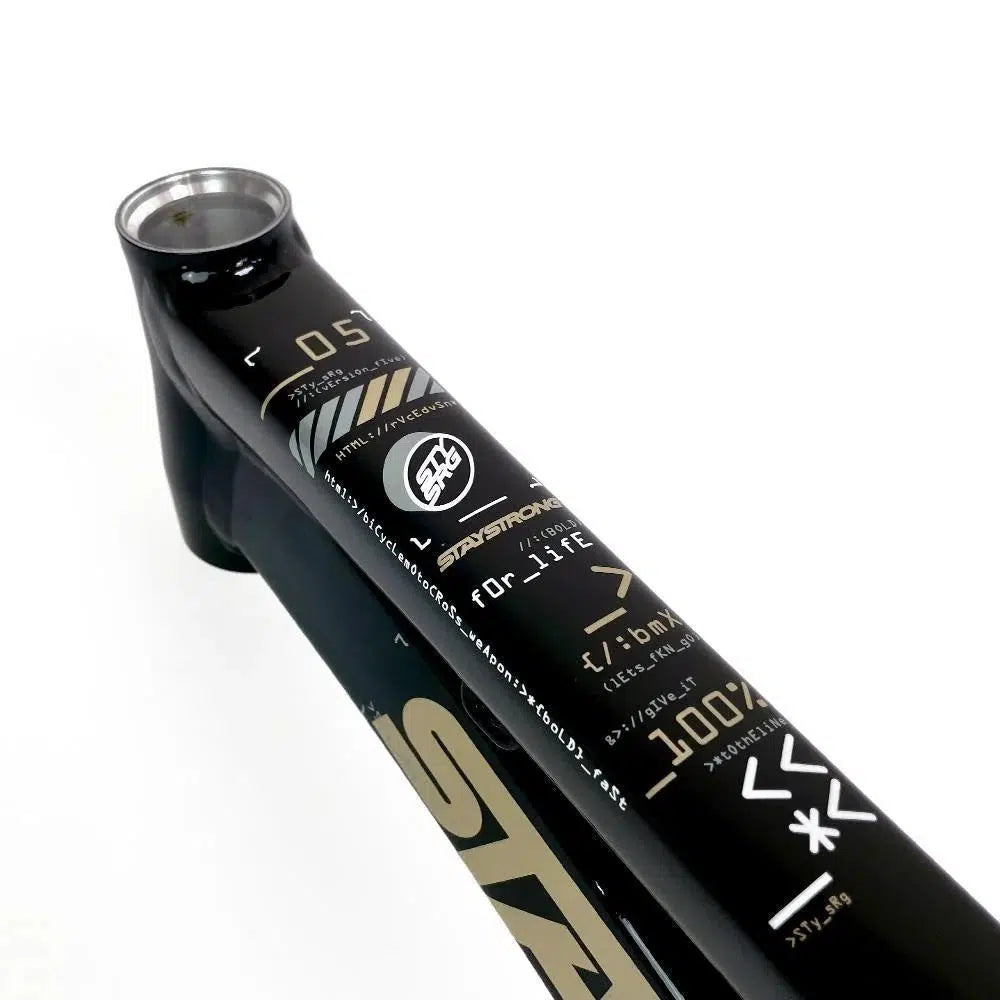 Close-up of a Staystrong V5 Disc Pro L Frame featuring various logos, graphics, and text, including the number "05" and some Japanese characters. The robust 6061 alloy tubing is complemented by precision-engineered disc brakes for superior control.