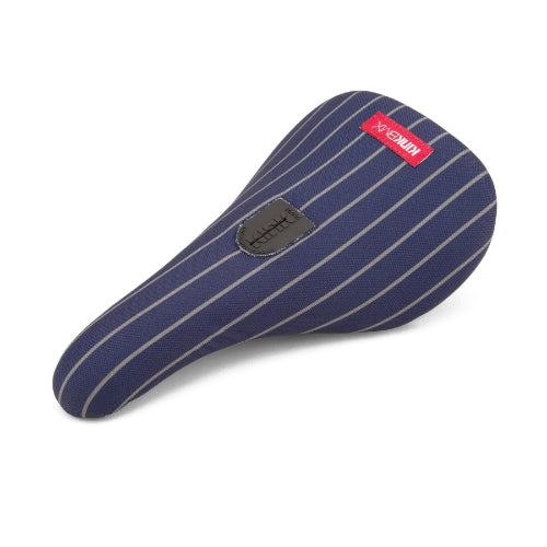 Enhance your Kink BMX ride with the elegant Kink Pinstripe Pivotal Seat, featuring navy blue and white stripes, a sleek black patch, and a vibrant red label on top.