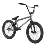 The Raven LC 20 Inch Bike is a gray BMX bike featuring a sturdy Cro-Mo frame with the brand name "Raven" on it, black tires, and handlebar grips. It comes equipped with Alloy Double Wall Rims for enhanced durability and a dependable Rear Alloy U brake for smooth stopping.