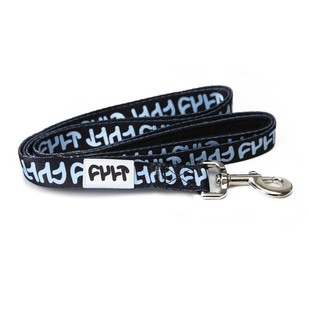 The Cult Dog Leash is a heavy-duty black and white leash with a padded handle, metal clip, and a repeated graphic design.