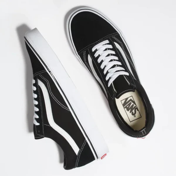 A pair of Vans Kids Old Skool Black/White sneakers displayed on a white background, highlighting both side and top views. Expertly crafted for style, these shoes are perfect for small kids who appreciate classic designs.