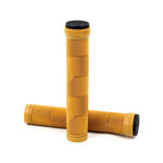 A pair of Animal Edwin V2 Signature Grips Flangeless in yellow, featuring textured surfaces and black plastic bar ends, with one grip standing upright and the other lying horizontally.