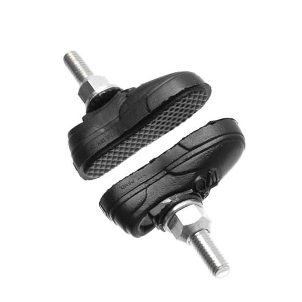 The Kool Stop X Vans Brake Pads are two black rubber pads with threaded metal stems, displayed against a white background and oriented in opposite directions.