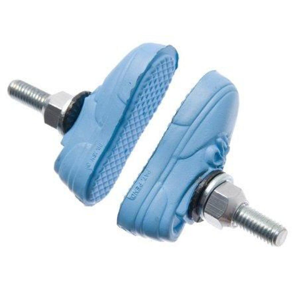 Pair of Kool Stop X Vans blue sneaker-shaped bike brake pads with bolts, positioned facing each other.