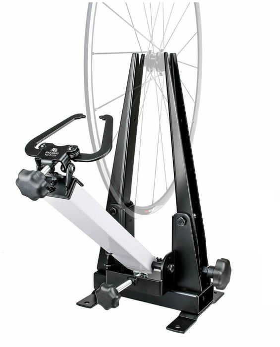 The Wheel Truing Stand (16-29 Inch) includes a mounted wheel, adjustable knobs, and a sturdy metal frame for precision truing across various rim widths.