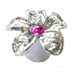 The Flower Valve Cap, featuring a silver flower shape with a pink center, adds a touch of charm to your vehicle.