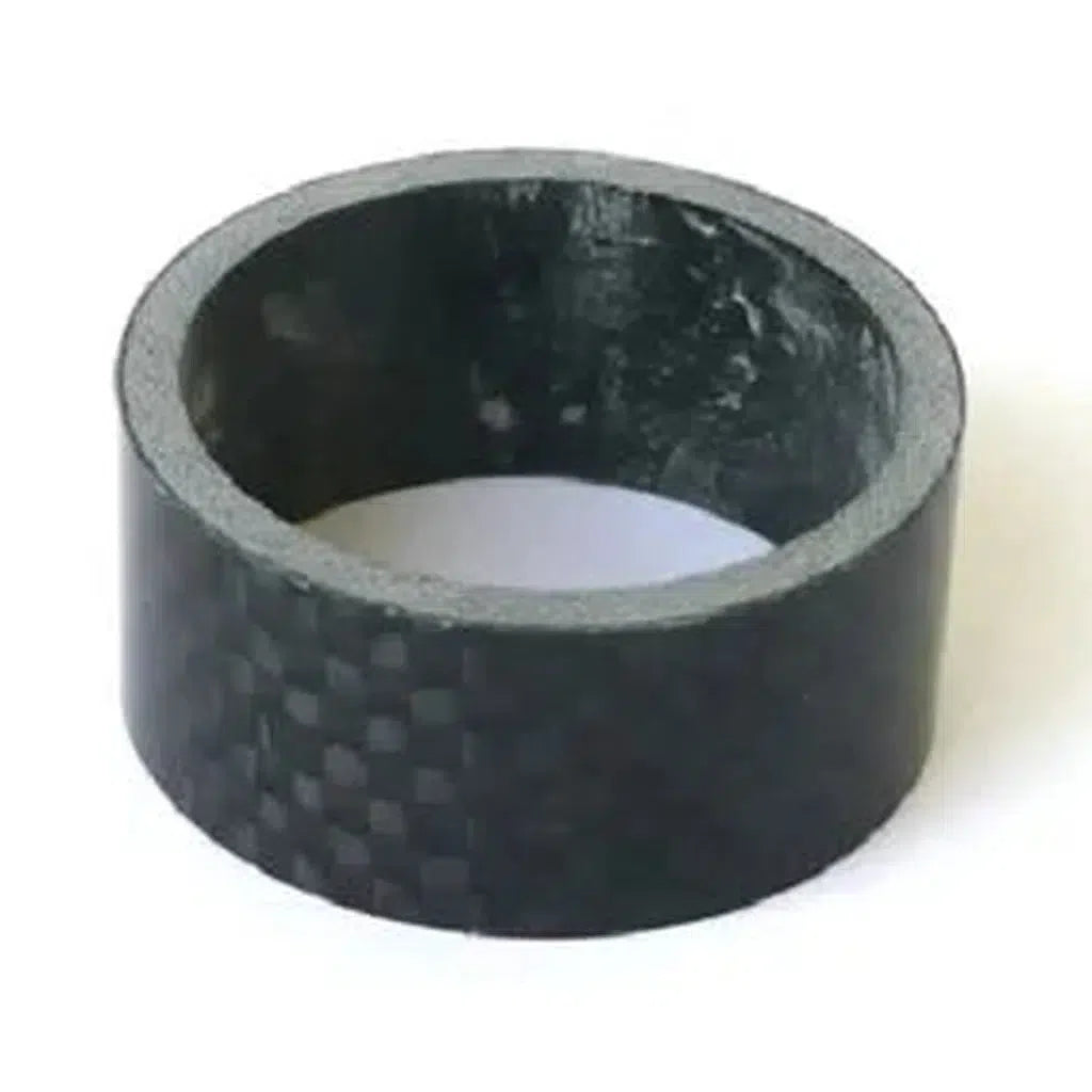 A black Carbon Headset Spacer / 1-1/8th, made of carbon fiber with a textured surface, is positioned upright on a white background, showcasing millimeter-perfect precision.