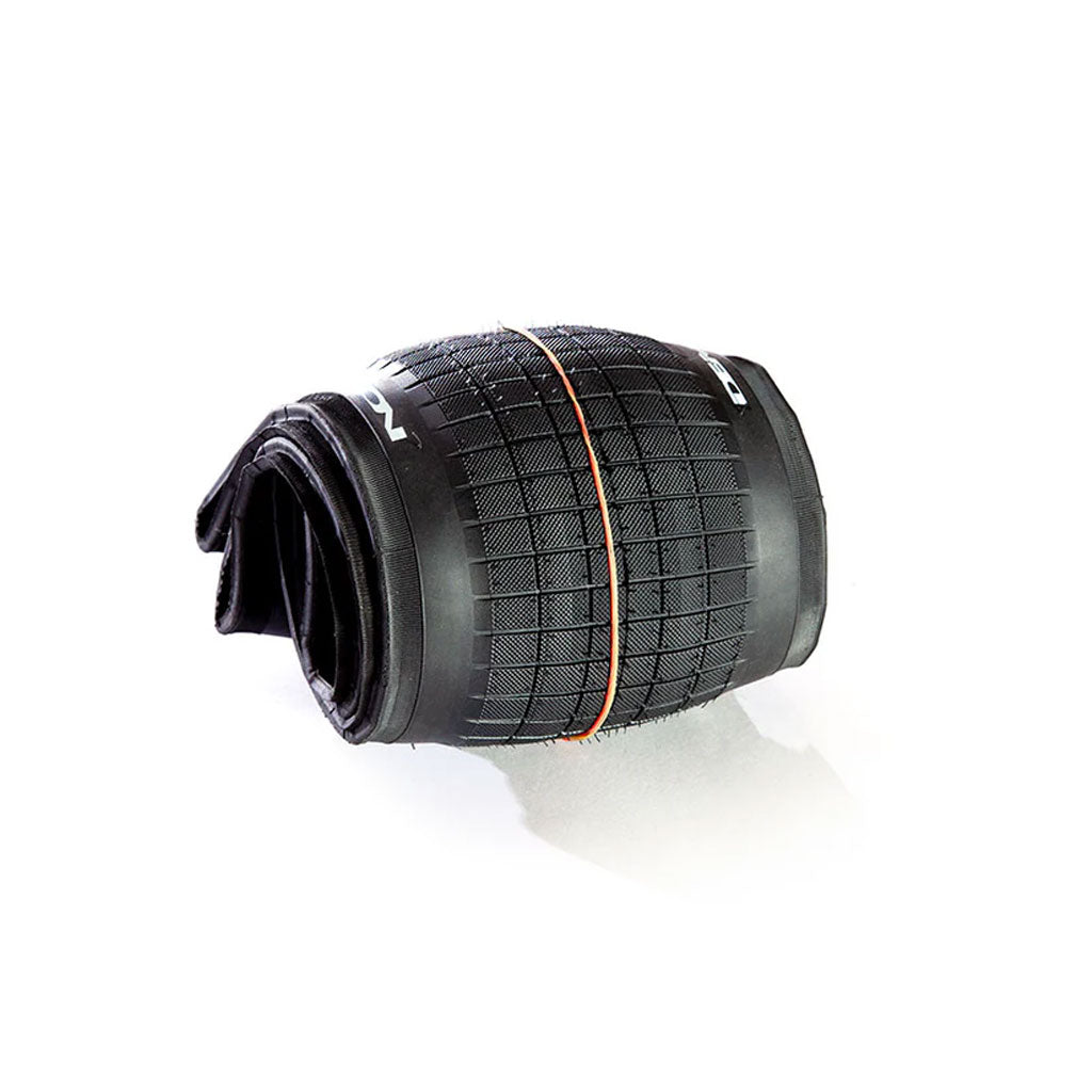 A rolled black Hammerhead - Street (S) Folding Tire, lightweight and durable, with a rubber band around it on a white background. This tire is designed for both performance and style.