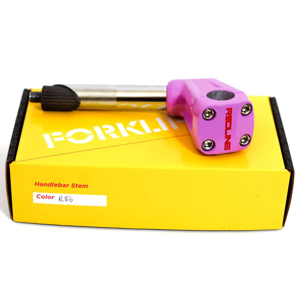 A purple REDLINE BY KASTAN Forklifter Front Load Stem, with bold "REDLINE" branding, is displayed on a yellow box labeled "FORKLIF," featuring "Handlebar Stem Color R85" on the side. Perfect for BMX Freestyle enthusiasts.