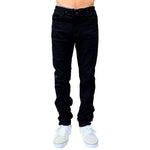 Person wearing FP Pants Relaxed Fit Chino Black and white sneakers, cropped at the torso.