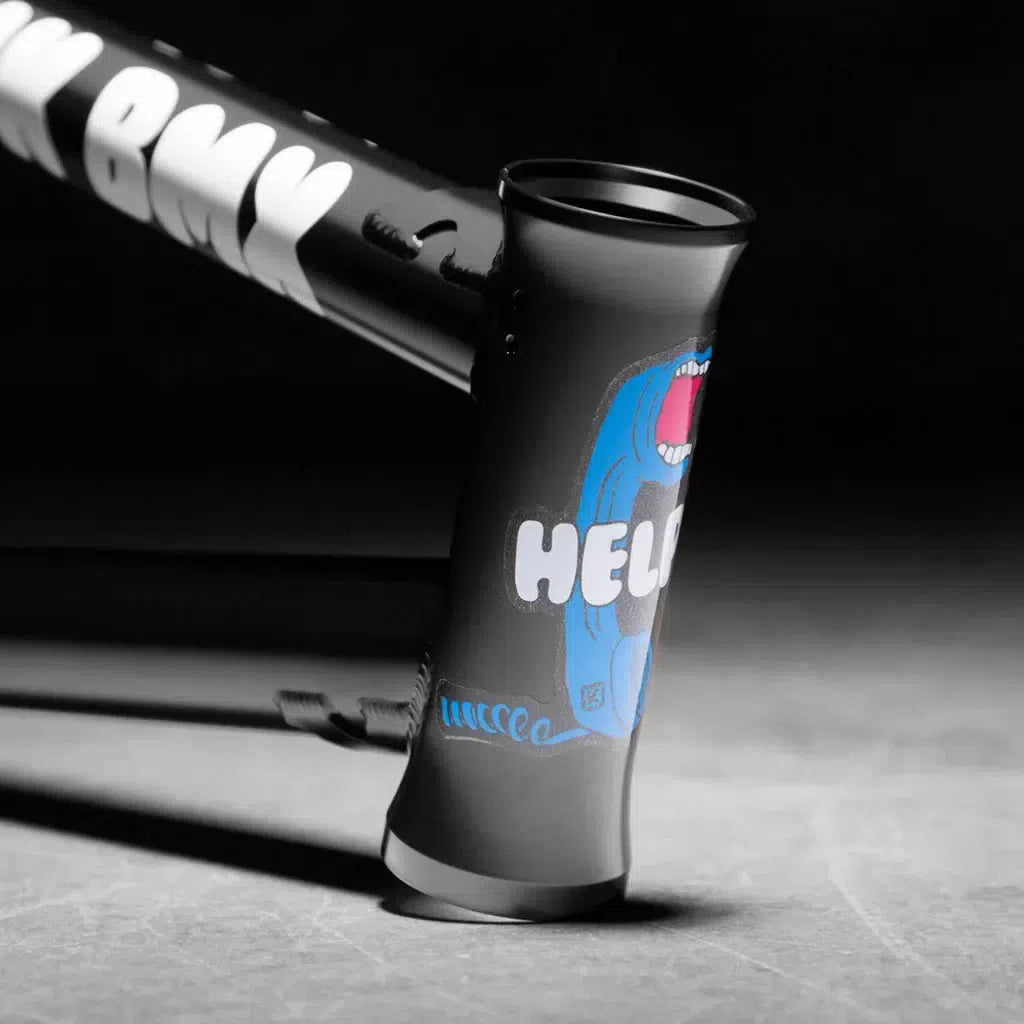 The image showcases a BMX bike frame, the Kink Williams (Nathan Williams Signature) Frame, with "HELLO" and a blue cartoon monster face on the head tube against a gray background.