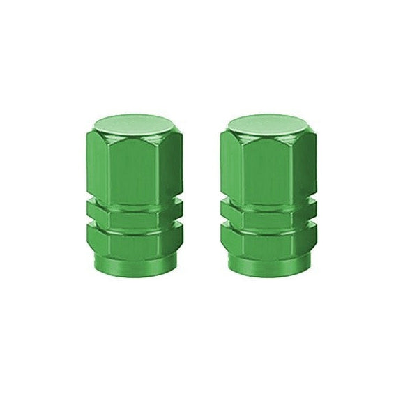 A pair of Hexagon Valve Caps in vibrant green metal is displayed on a pristine white background, perfect for adding a pop of color to any ride.