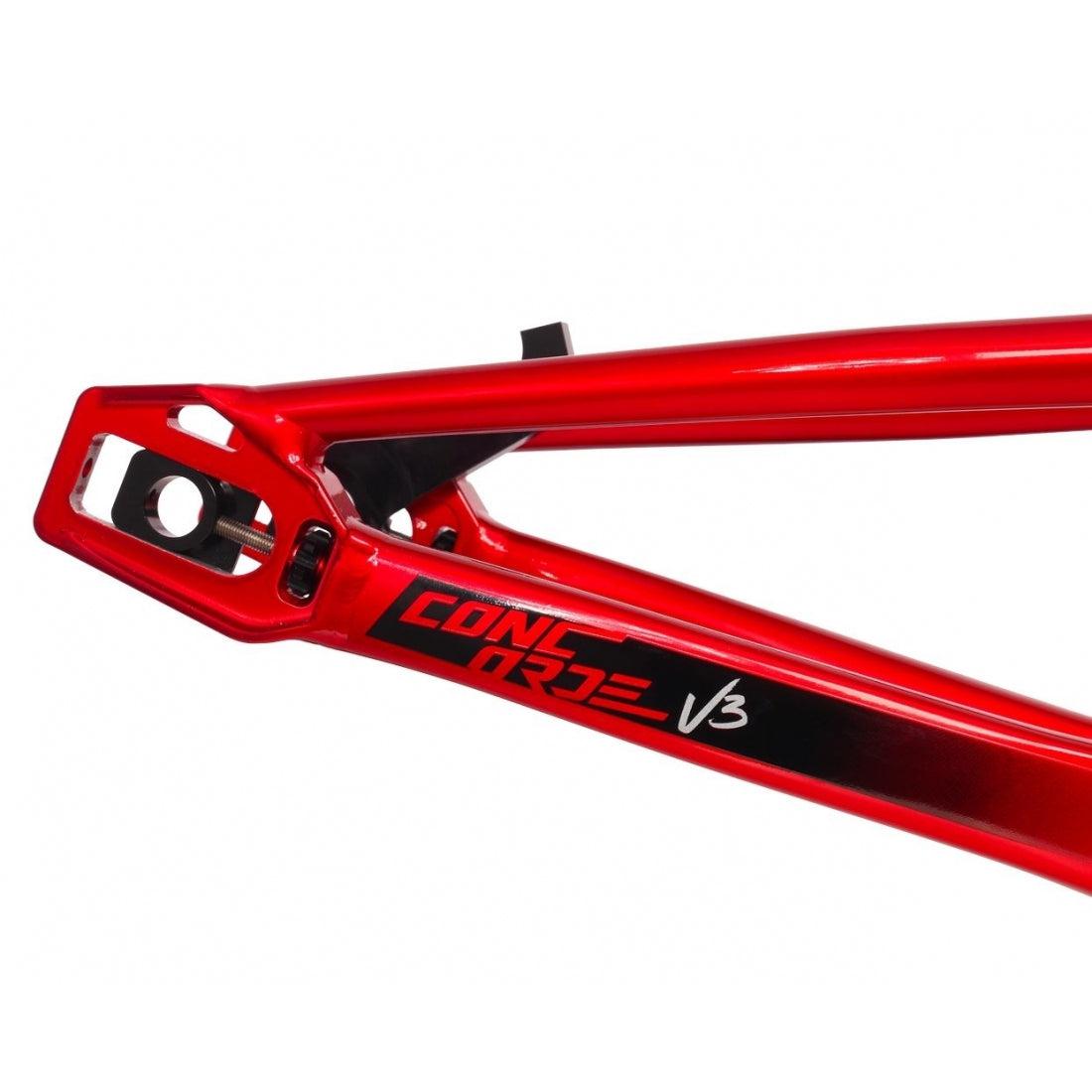 Close-up of the Inspyre Concorde V3 Pro L Frame in red, crafted from hydroformed aluminium and featuring black "Concorde V3" text on the side, highlighting its lateral rigidity.