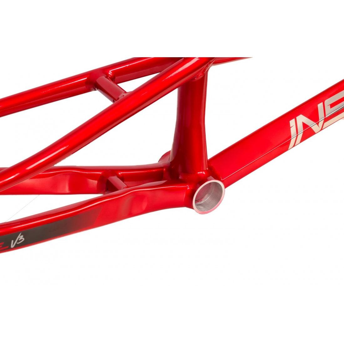 Close-up of the Inspyre Concorde V3 Pro L Frame in red, highlighting the intricate details of the bottom bracket and part of the frame joint. The design emphasizes lateral rigidity, crafted from precision-engineered hydroformed aluminum for superior performance.