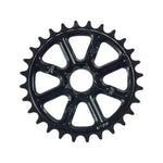 The Madera Helm Spline Drive Sprocket is a black bicycle chainring made from 7075 aluminum with a splined steel insert, featuring 20 teeth in a symmetrical design, elegantly displayed against a plain white background.