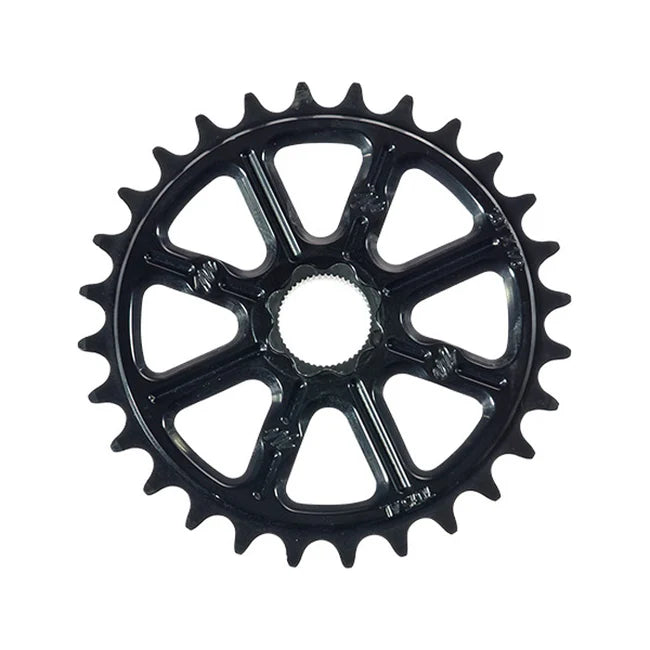 The Madera Helm Spline Drive Sprocket is a black bicycle chainring made from 7075 aluminum with a splined steel insert, featuring 20 teeth in a symmetrical design, elegantly displayed against a plain white background.