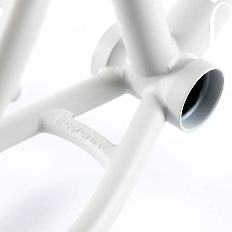 A close up of a white bicycle frame featuring the Federal Lacey 3 Frame.