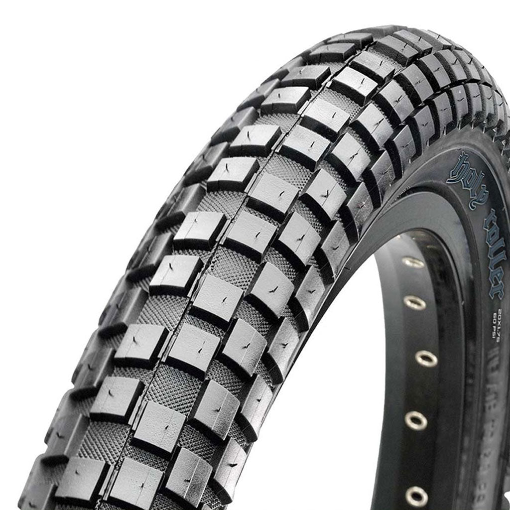 Close-up of a 24 inch MAXXIS HOLY ROLLER Tyre (24" X 2.40) with a rugged, knobby tread pattern and visible side markings.