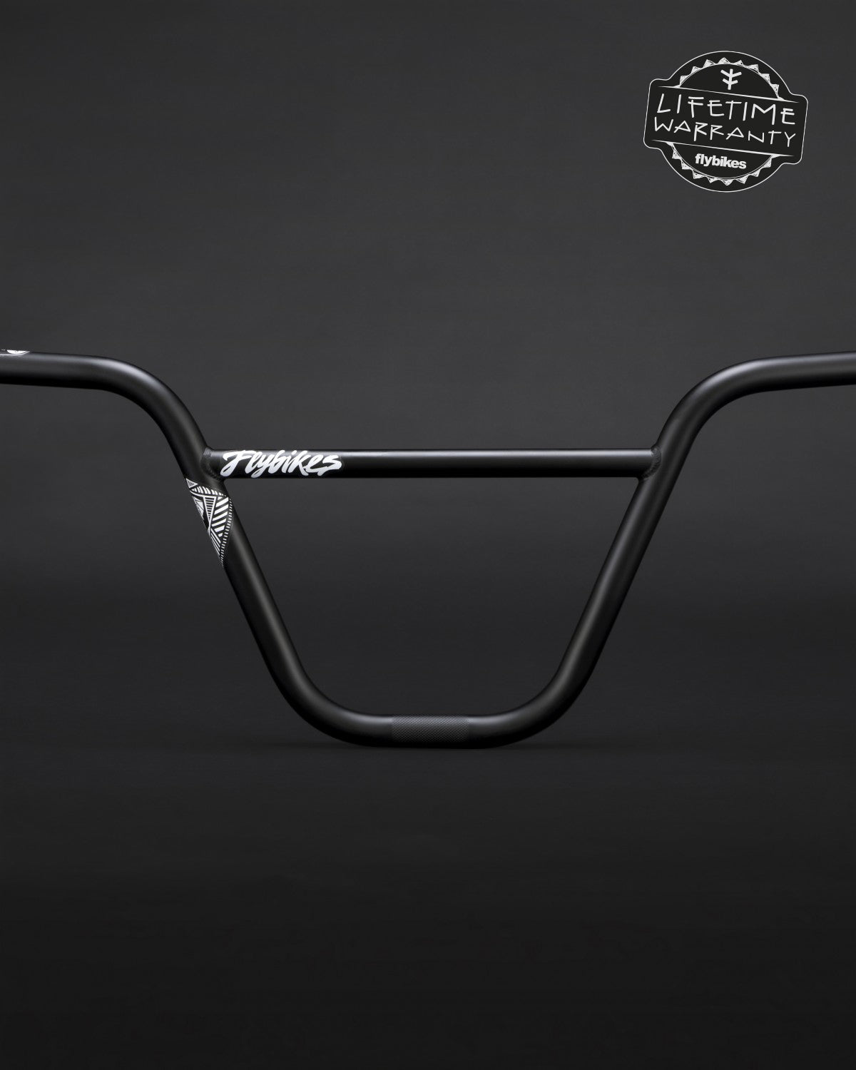 The Fly Bikes Savanna Bars, black BMX handlebars, are made from durable 4130 CrMo steel with a "Lifetime Warranty" displayed in the top right corner on a dark background.