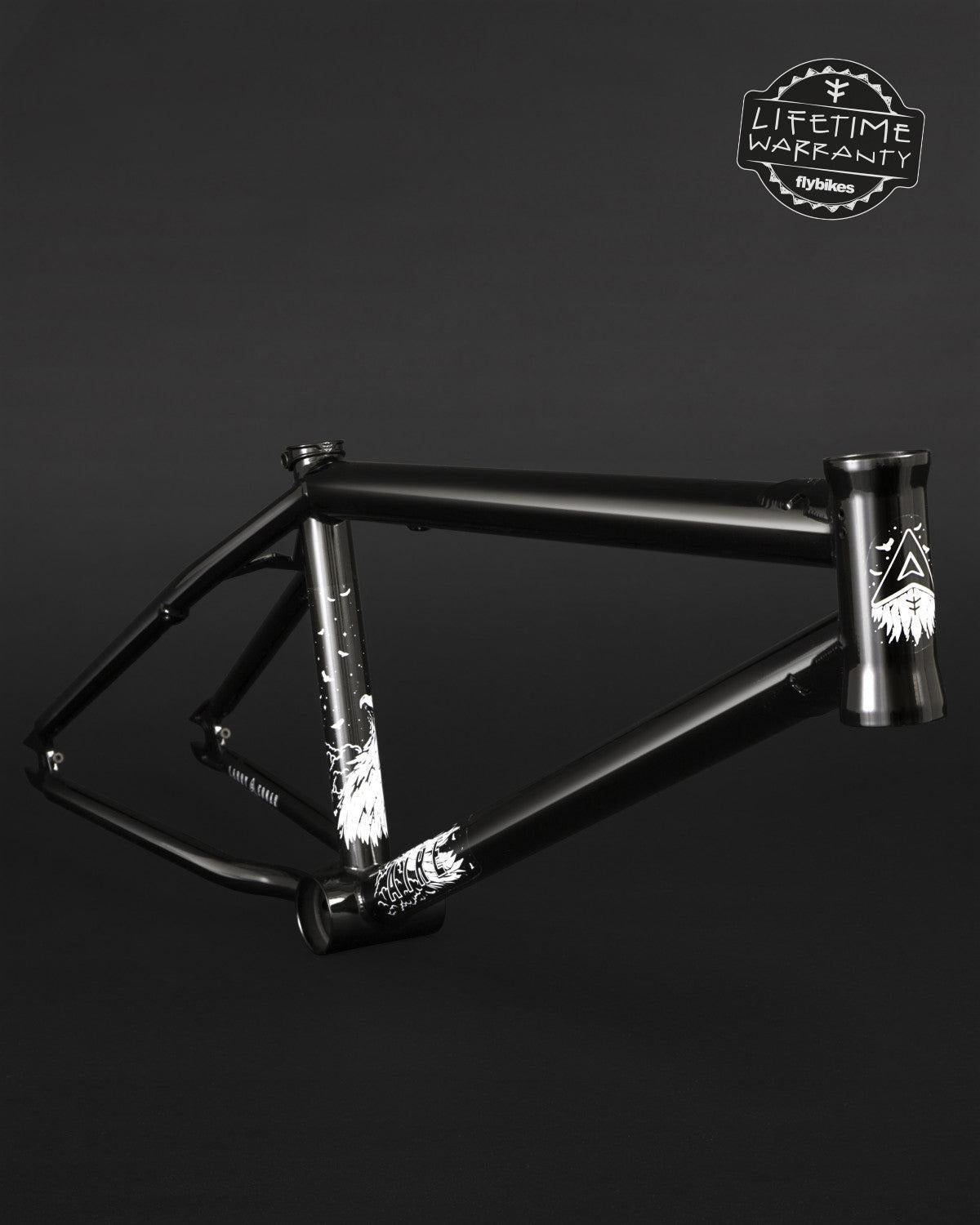 The Fly Bikes Aire Frame, crafted from durable 4130 Cr-Mo with white graphics on a dark background, comes with a "Lifetime Warranty" badge in the corner, ensuring strength and resilience for all your cycling adventures.