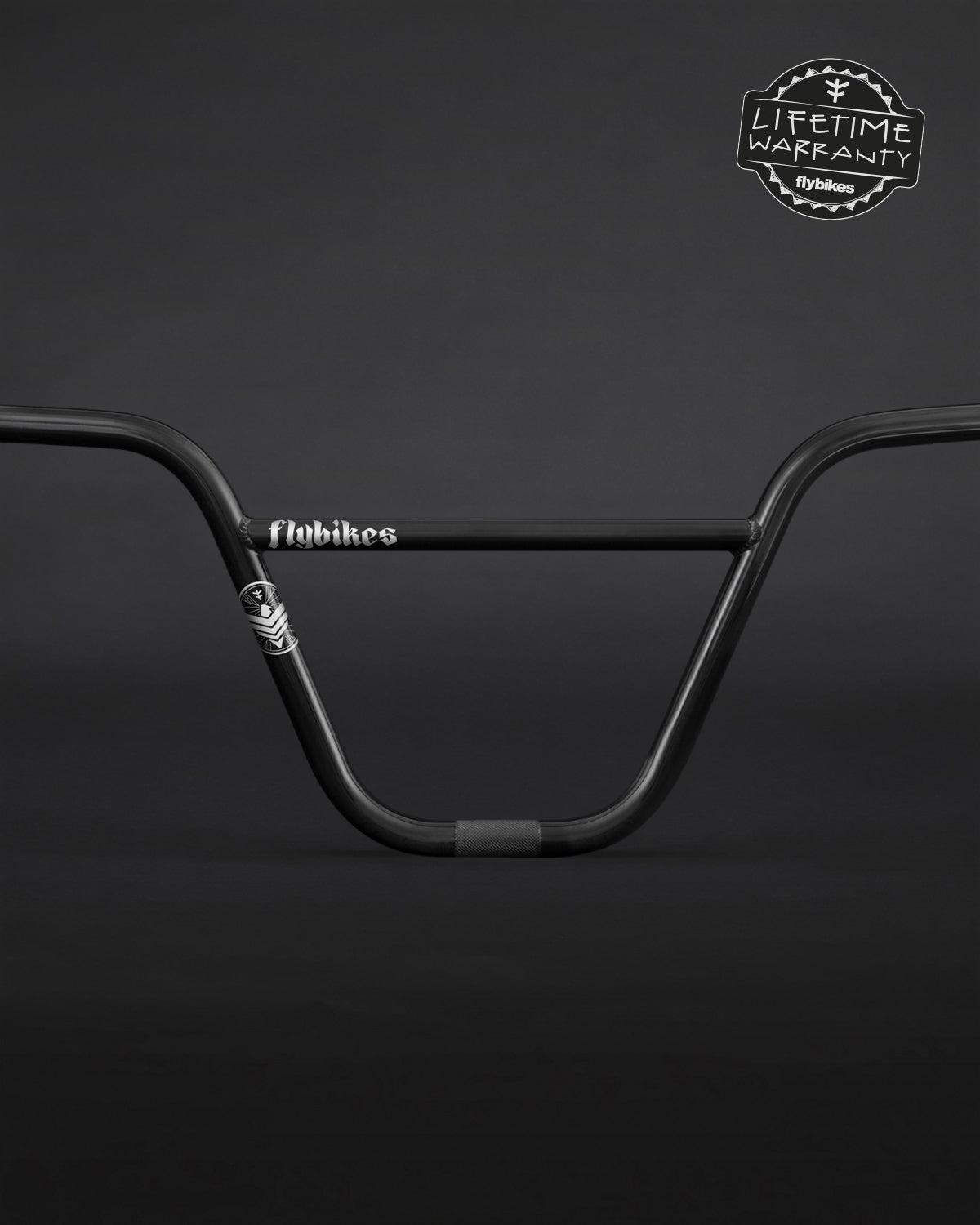 Black Fly Bikes Dove BMX handlebars on a dark backdrop, made from multi-butted 4130 CrMo, with a Lifetime Warranty badge in the top right corner.